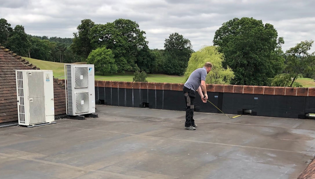 Justin measuring roof